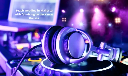 Beach wedding in Mallorca with DJ mixing on deck near the sea