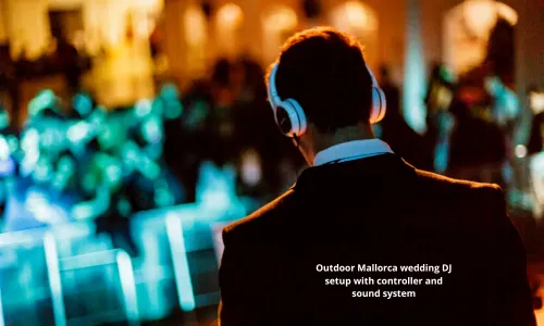Outdoor Mallorca wedding DJ setup with controller and sound system